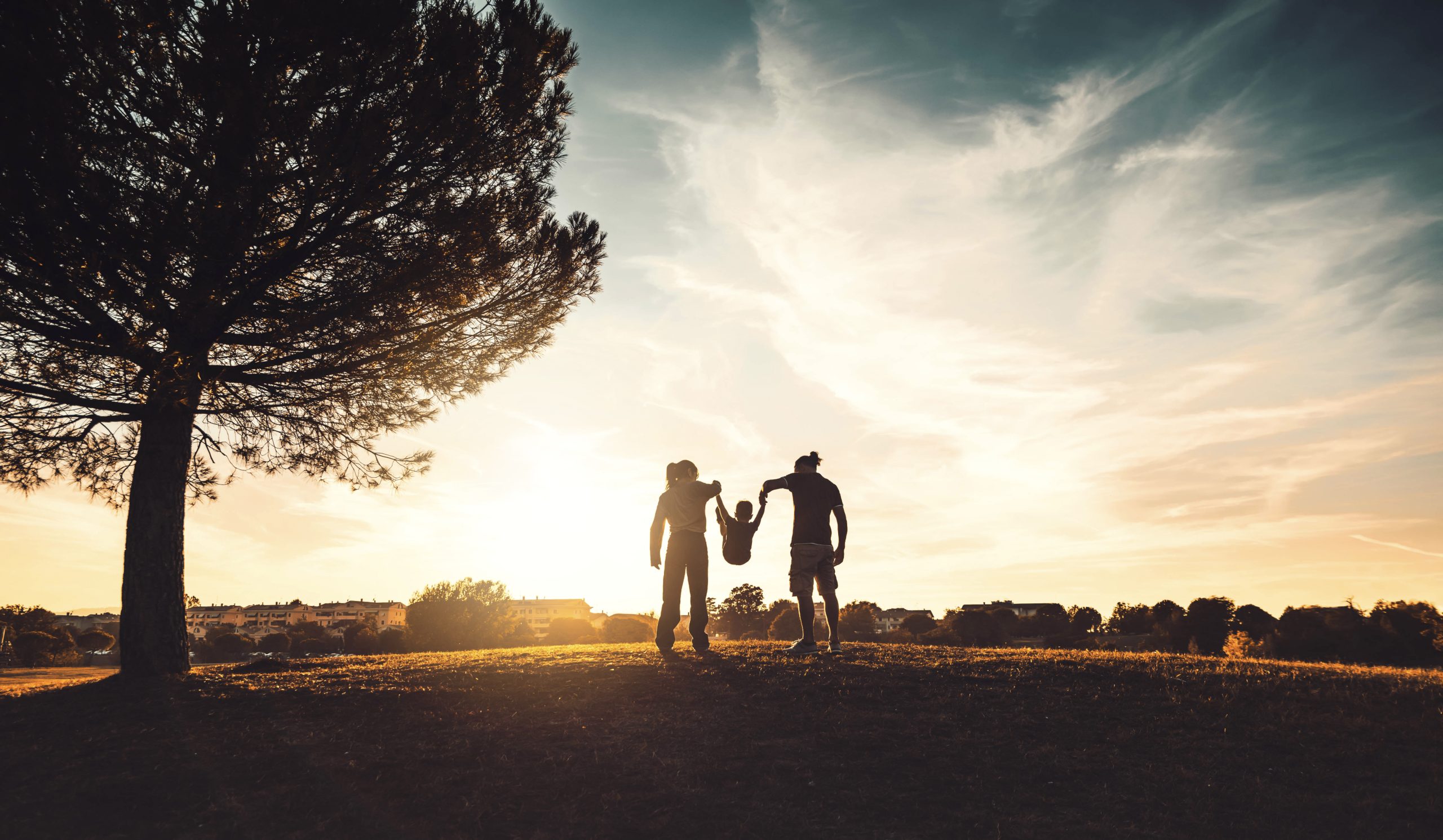 family silhouette sunset